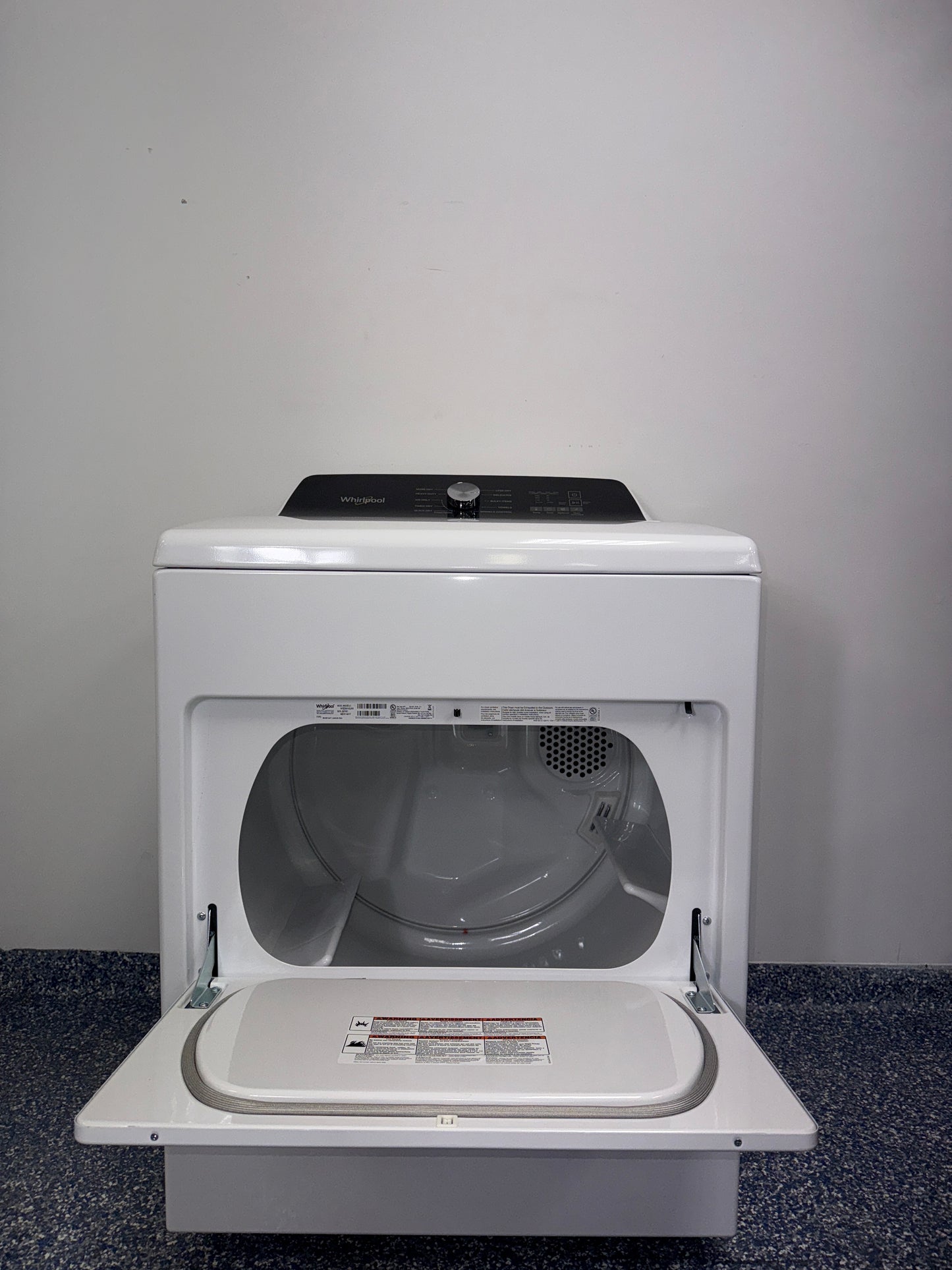 The interior of the WHIRLPOOL WGD5010LW dryer, showcasing its spacious 7.0 cu. ft. capacity, for sale in Kansas.