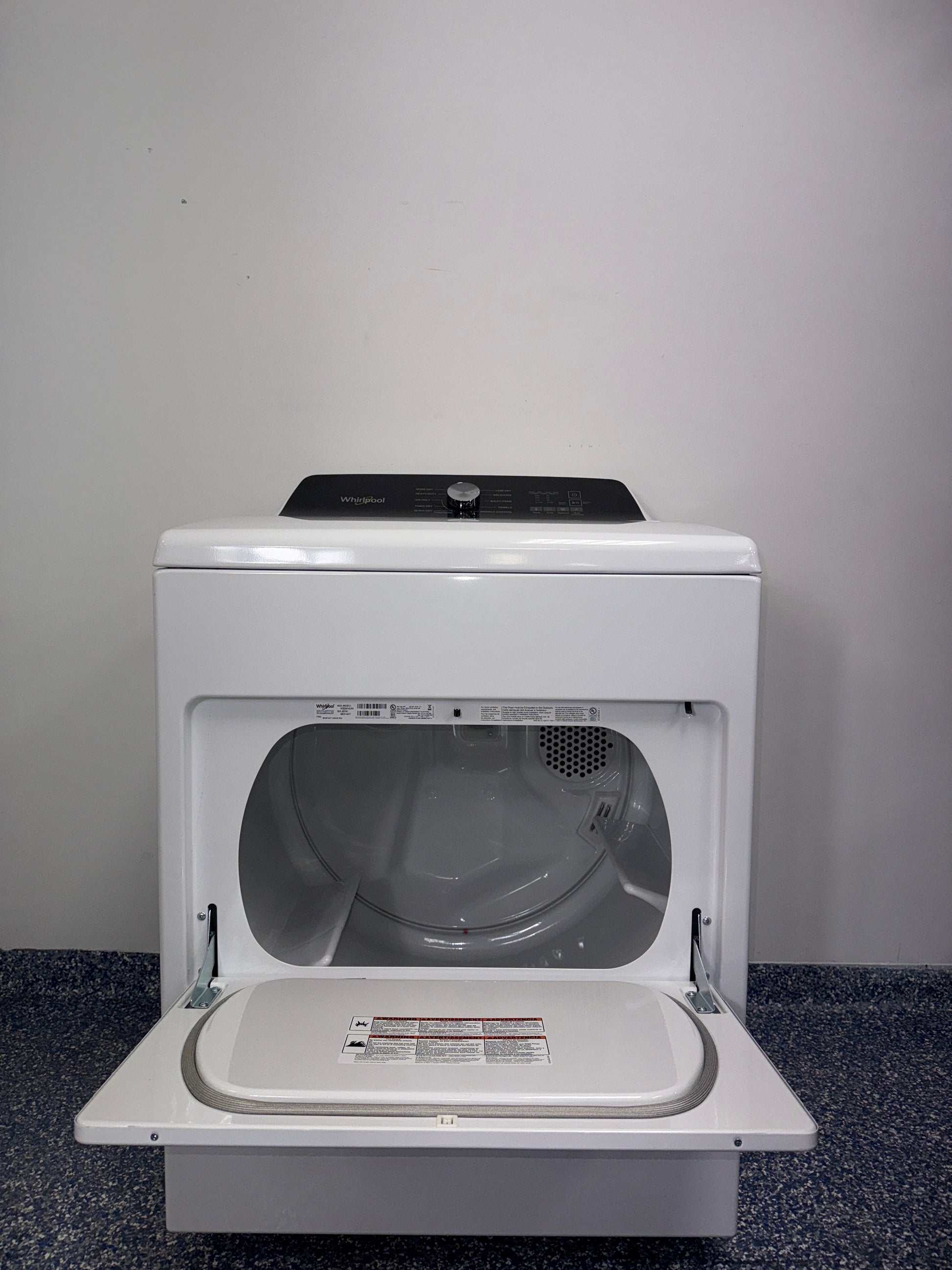 The interior of the WHIRLPOOL WGD5010LW dryer, showcasing its spacious 7.0 cu. ft. capacity, for sale in Kansas.