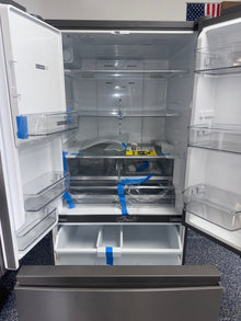 Interior shot of the WHIRLPOOL WRFF3536SZ refrigerator showing adjustable glass shelves and crispers, featured in Kansas City.