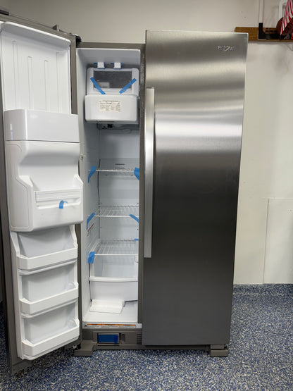 View of the interior of the Whirlpool WRS315SDHZ freezer, highlighting the indoor ice maker and wire shelving. On sale at Appliance Shark - Scratch & Dent store | Kansas City.