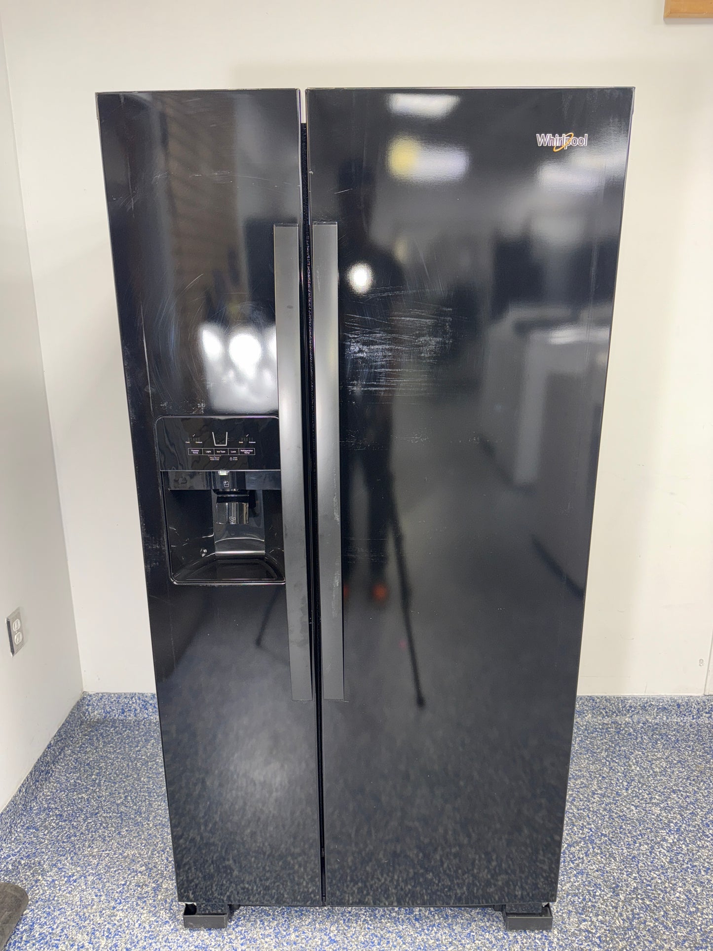 Front view of the WHIRLPOOL WRS321SDHB11 side-by-side refrigerator in Overland Park, KS.