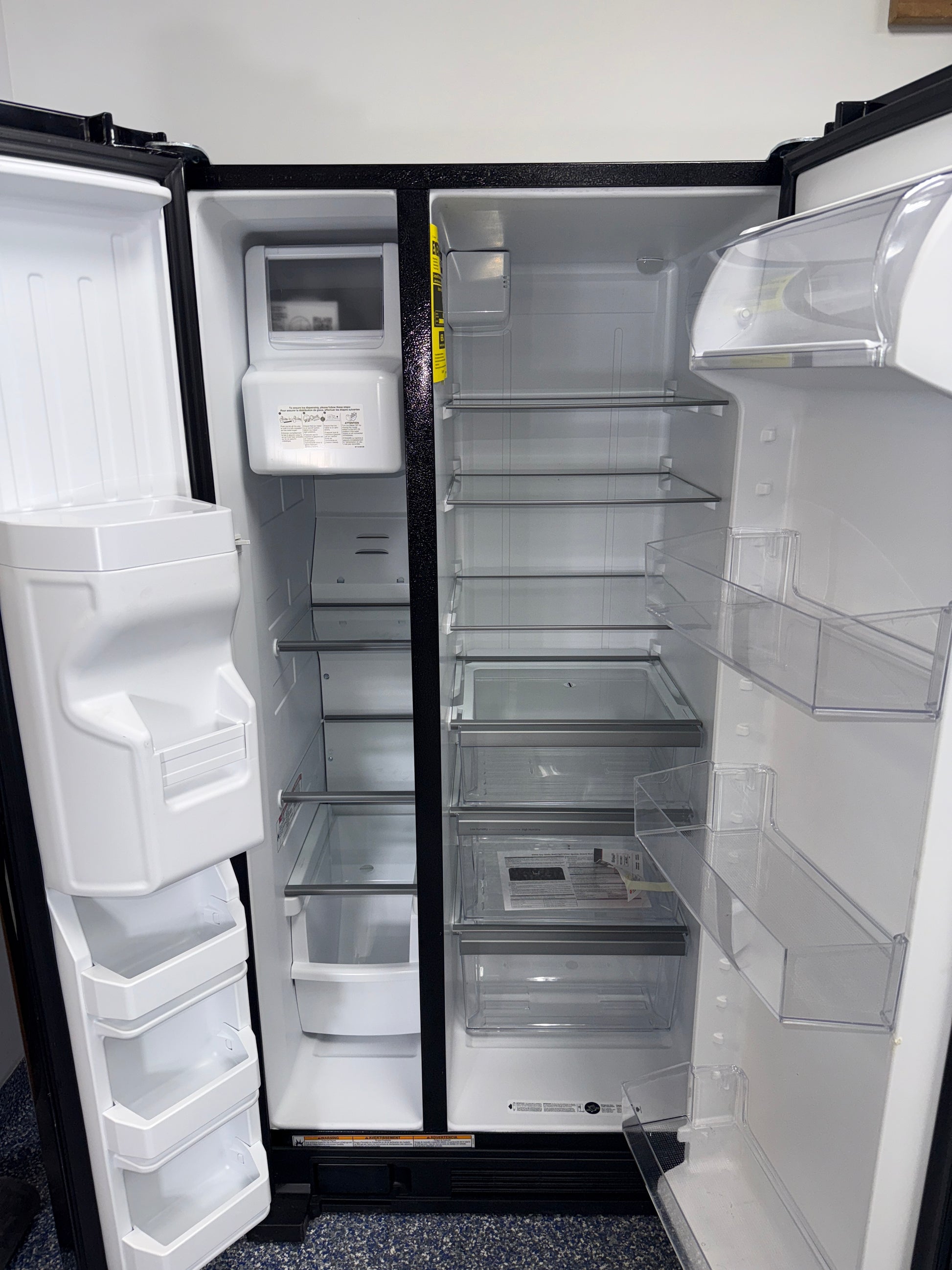 External ice and water dispenser on the WHIRLPOOL WRS321SDHB11 refrigerator near Kansas City.