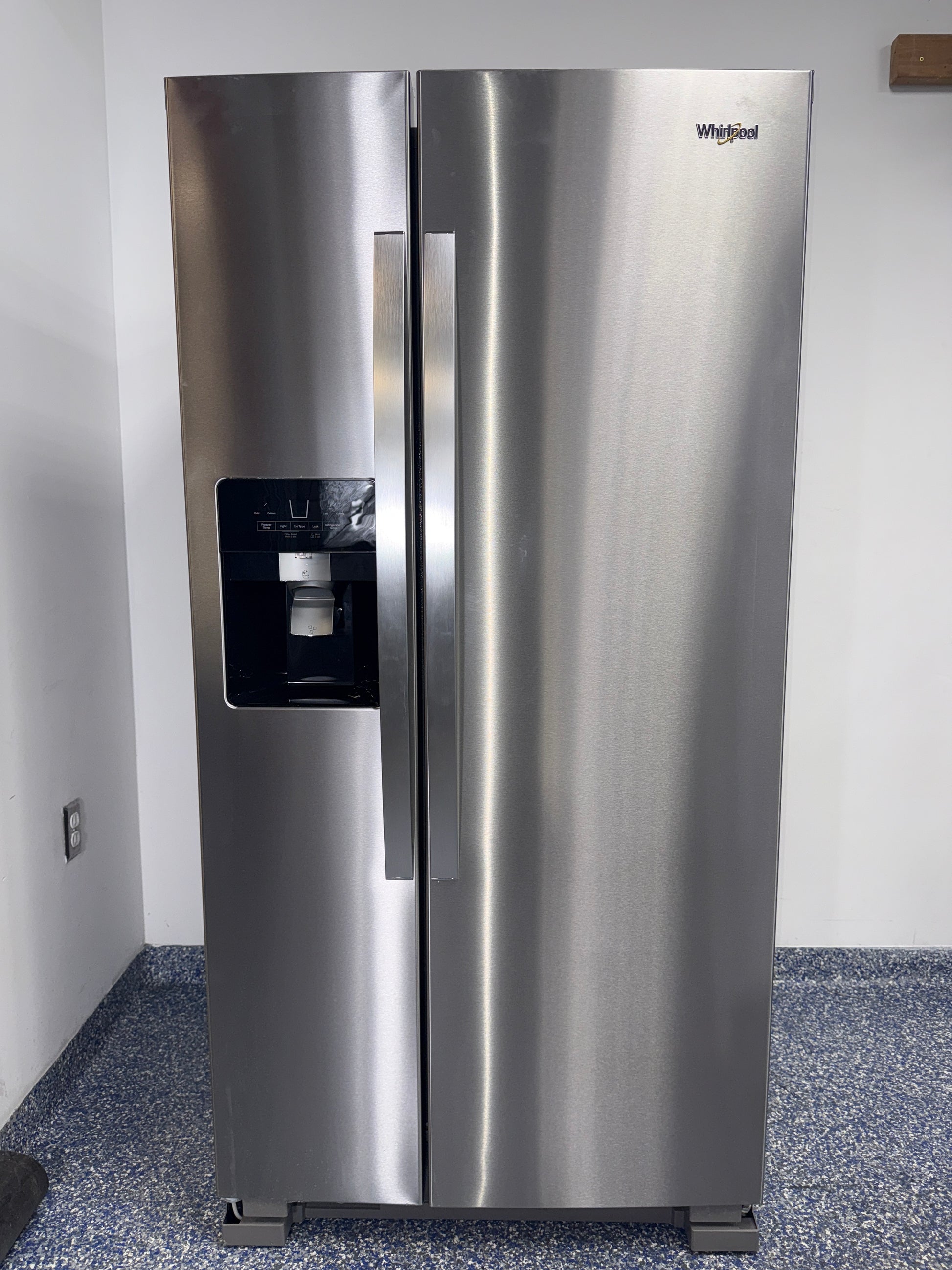 Front view of the WHIRLPOOL WRS321SDHZ13 21.4 cu ft side-by-side refrigerator in stainless steel, available in Overland Park, KS.
