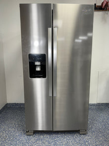 A full view of the Whirlpool WRS325SDHZ side-by-side refrigerator in fingerprint-resistant stainless steel with an exterior water and ice dispenser.