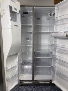  A close-up of the interior of the WRSC5536RZ refrigerator, highlighting the Frameless Glass Shelves and Adjustable Gallon Door Bins. On sale at Appliance Shark - Scratch &amp; Dent store | Kansas City.