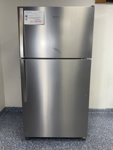 A full frontal image of the WHIRLPOOL WRT311FZDZ05 top freezer refrigerator, highlighting its clean white finish and streamlined design. On sale at Appliance Shark - Scratch & Dent store | Kansas City.