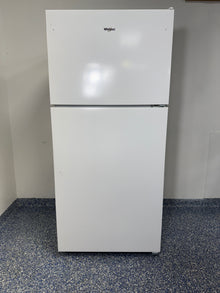 A full frontal image of the WHIRLPOOL WRT318FZDW top freezer refrigerator, highlighting its clean white finish and streamlined design. On sale at Appliance Shark - Scratch & Dent store | Kansas City.