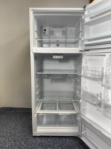 A close-up of the interior of the WRT518SZFW refrigerator, highlighting the Flexi-Slide™ Bin and Frameless Glass Shelves. On sale at Appliance Shark - Scratch & Dent store | Kansas City.