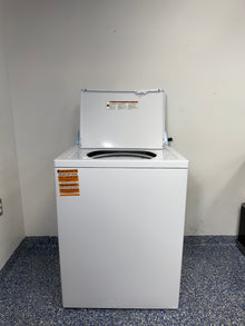 An overhead shot of the Whirlpool WTW4816FW with the lid open, showcasing the large wash tub and dual-action spiral agitator.

