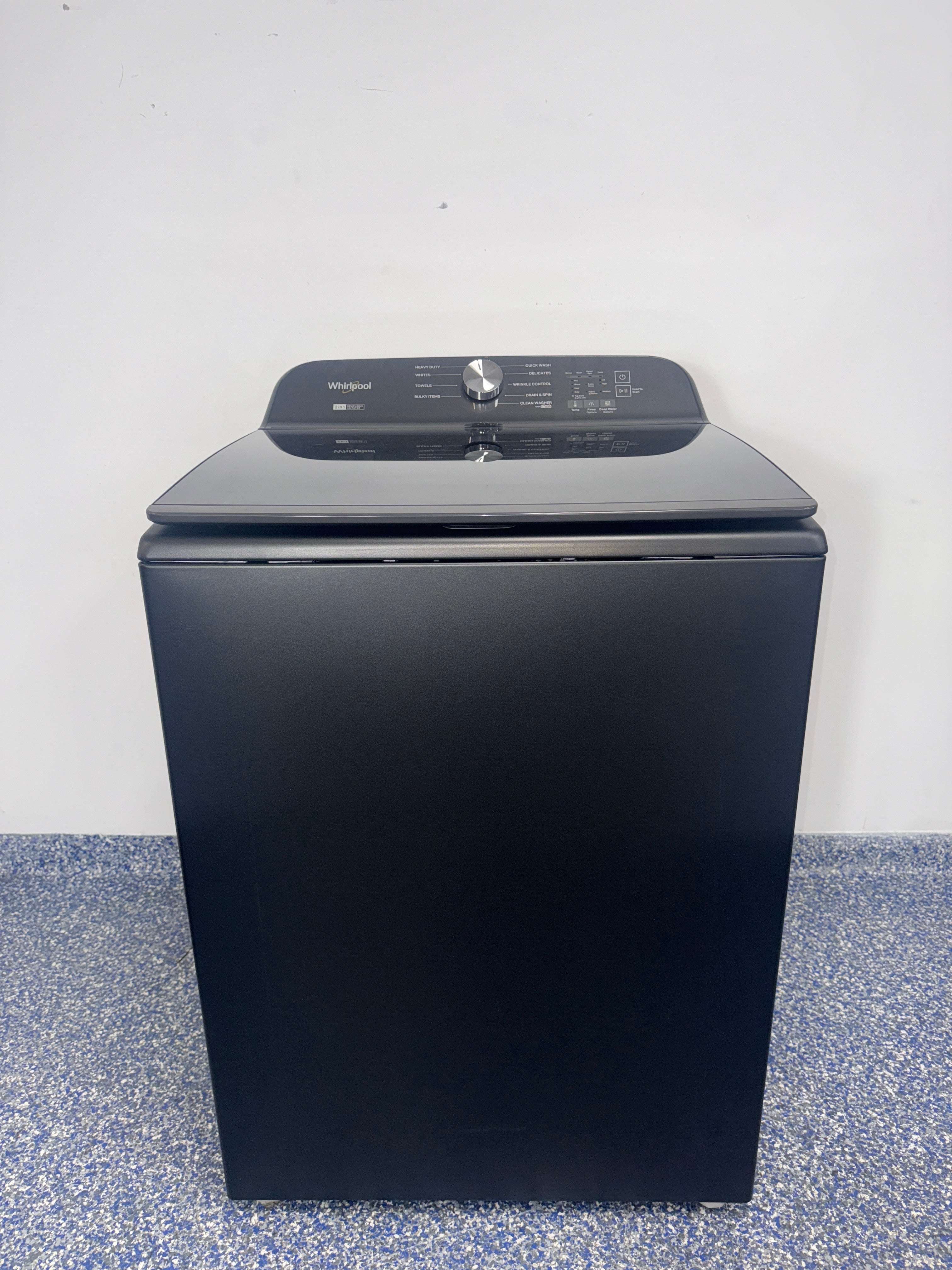Front view of the WHIRLPOOL WTW6157PB1 top-load washer in Volcano Black, available in Overland Park, KS.