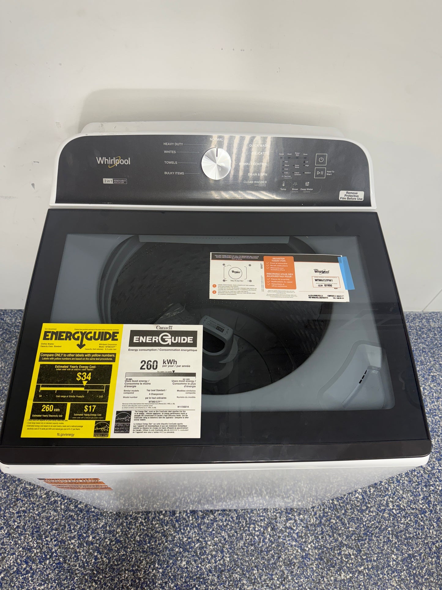 Close-up of the EasyView™ Full-Width Slow-Close Glass Lid on the WHIRLPOOL WTW6157PW, located in Overland Park, KS.