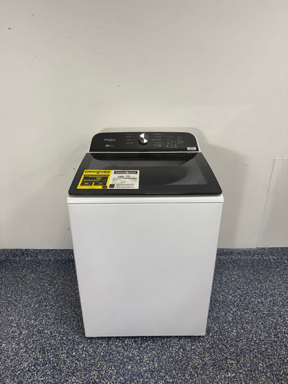 Front view of the WHIRLPOOL WTW6157PW1 top load washer installed in a Kansas City laundry room.